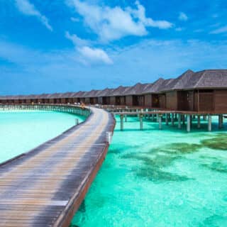 beach with water bungalows